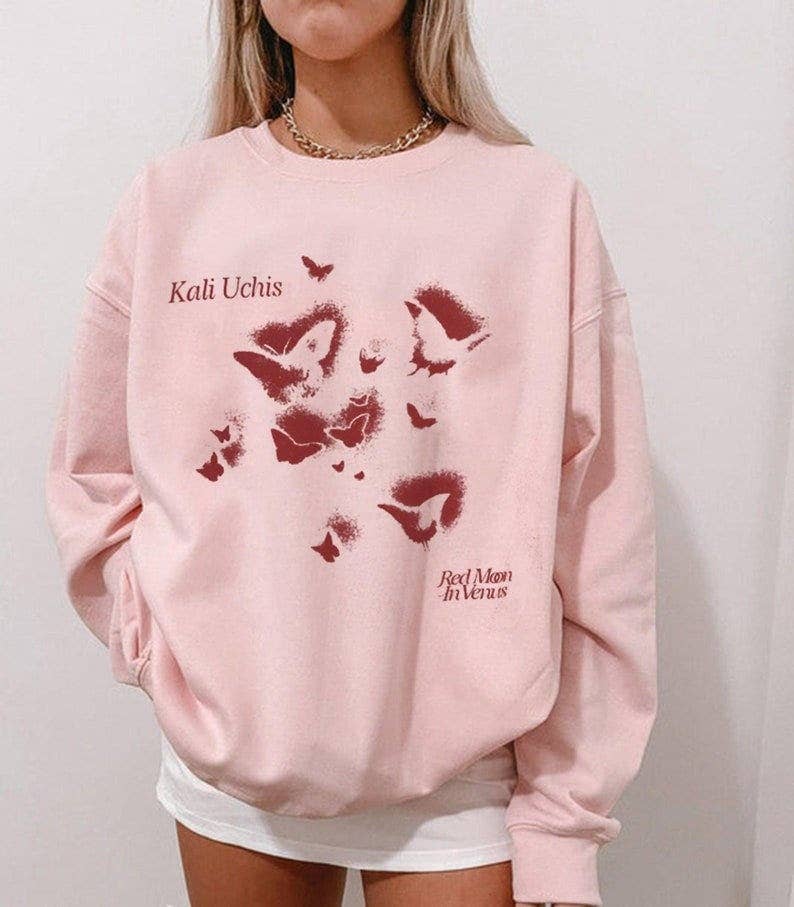 Kali Uchis 2023 Tour Red Moon in Venus Merch & Rmiv Album Sw Unisex T-shirt, Sweatshirt, Hoodie, Long Sleeve Tee - T-Shirt, Sweatshirt, Hoodie