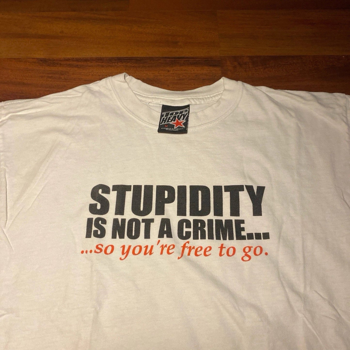 Vintage Top Heavy Stupidity Is Not a Crime Funny Quote Graphic Tee White Medium Unisex T-shirt, Sweatshirt, Hoodie, Long Sleeve Tee - T-Shirt, Sweatshirt, Hoodie
