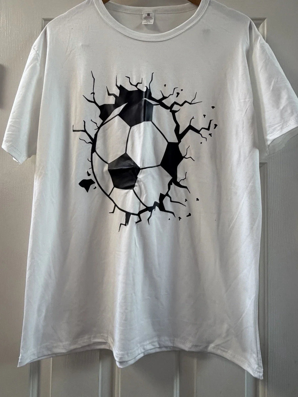 Soccer Ball Graphic T-Shirt Cracked Wall Design White Unisex Sports Tee Unisex T-shirt, Sweatshirt, Hoodie, Long Sleeve Tee - T-Shirt, Sweatshirt, Hoodie