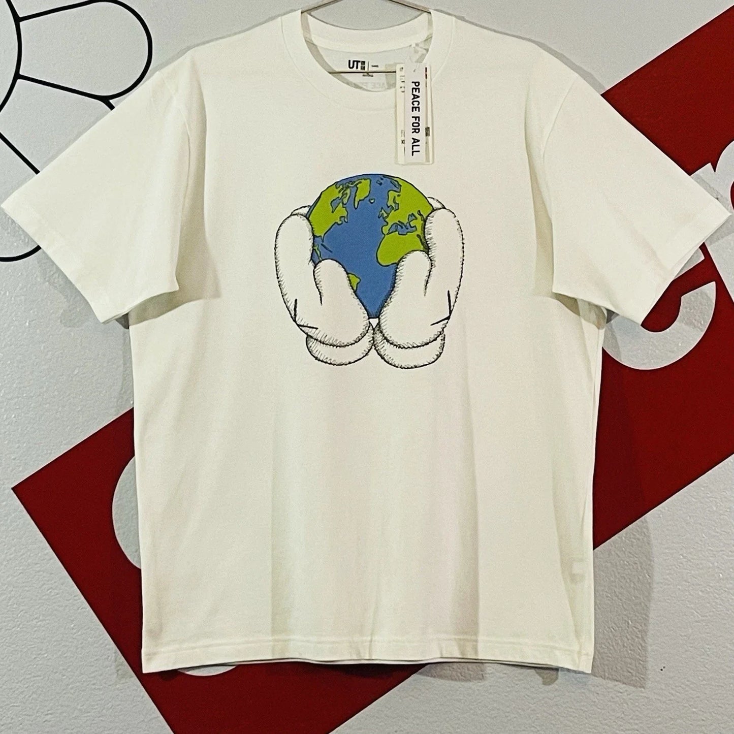 FW23 KAWS Uniqlo Peace For All Globe Hands Earth White Tee T Shirt XL Unisex T-shirt, Sweatshirt, Hoodie, Long Sleeve Tee - T-Shirt, Sweatshirt, Hoodie