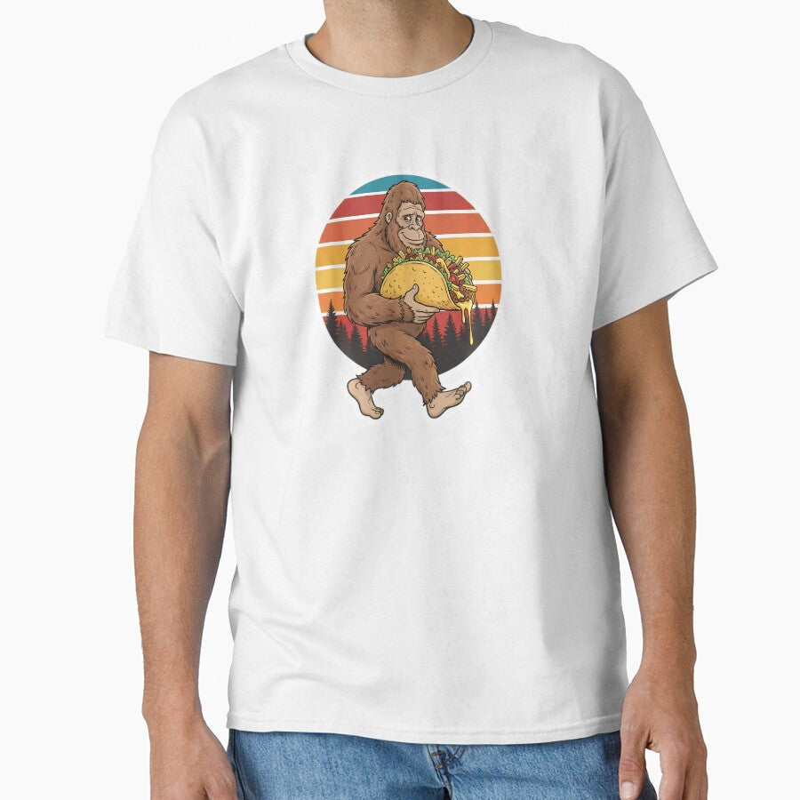 Bigfoot Carrying Taco Funny Cinco De Mayo by Le7yaStore Unisex T-shirt, Sweatshirt, Hoodie, Long Sleeve Tee - T-Shirt, Sweatshirt, Hoodie