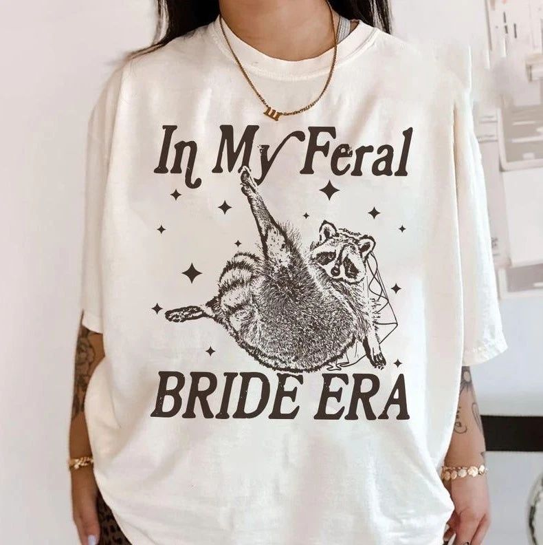 Cute In My Feral Bride Era T-Shirt, Funny Raccoon Tee, Funny Bride Tshirt Unisex T-shirt, Sweatshirt, Hoodie, Long Sleeve Tee - T-Shirt, Sweatshirt, Hoodie